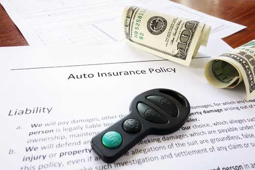 auto insurance policy with car remote and money